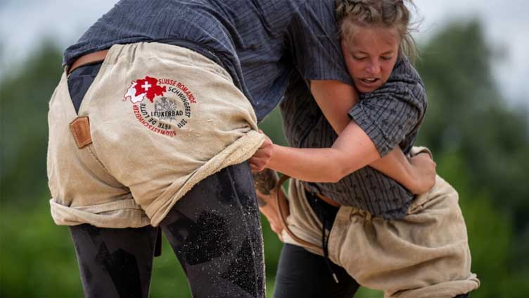 Women wrestlers battle for equality with Swiss 'schwinger kings'