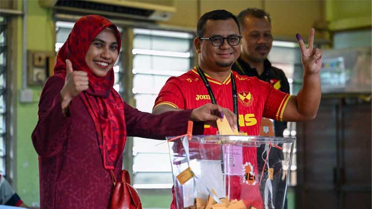Malaysians vote in six state elections seen as referendum on Anwar