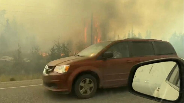 Thousands flee wildfires in Canada's far north