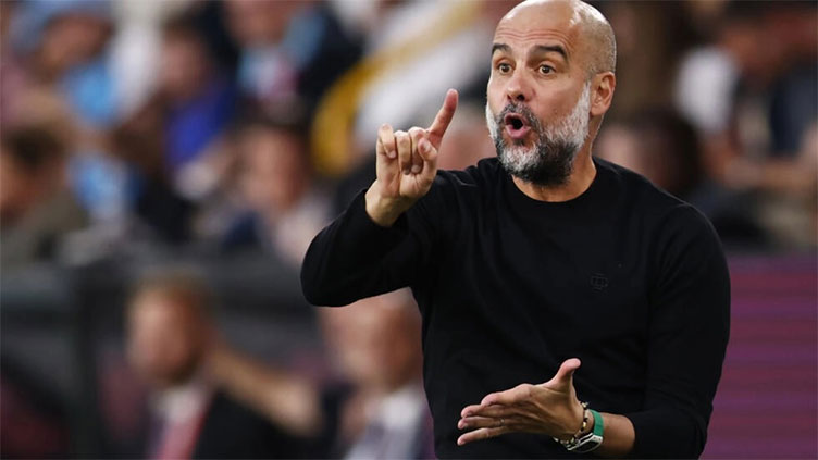 Man City manager Guardiola to miss two matches after back surgery