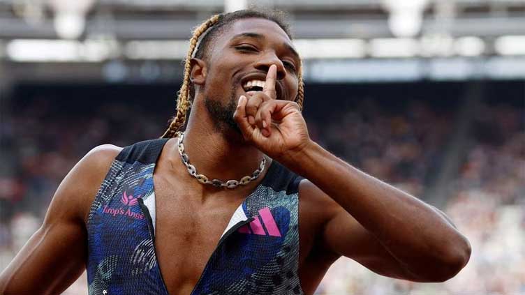 Lyles into final of world 200m despite golf buggy collision