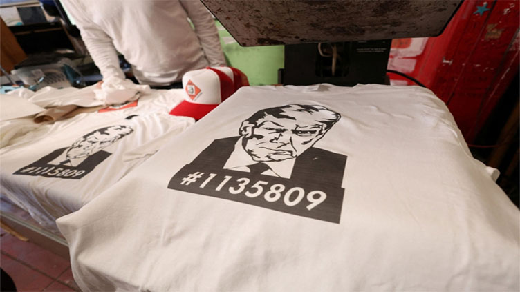 Divided US embraces Trump mugshot merchandise