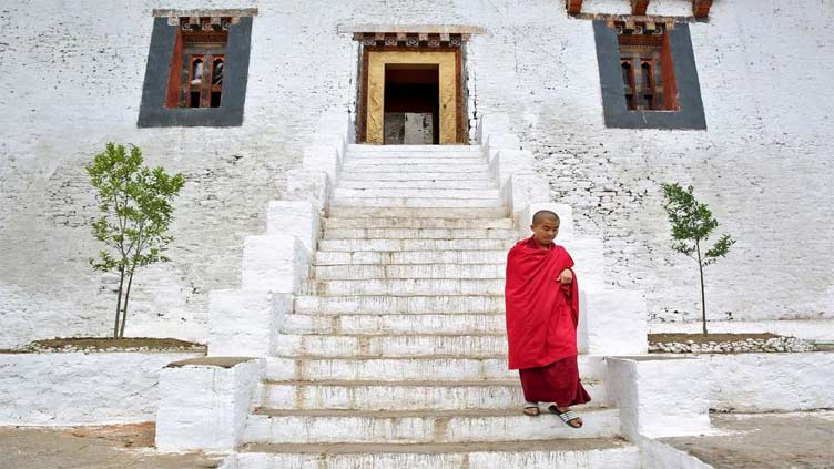 Bhutan cuts daily tourist fee by half to lure more visitors