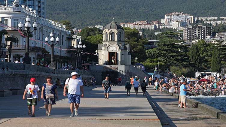 Russian tourism in Crimea is down, but many still shrug off risks