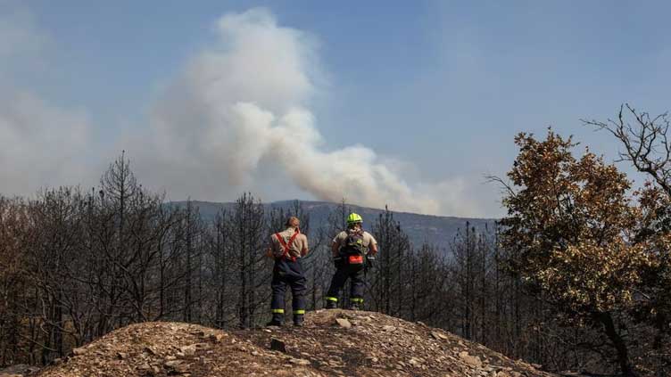 Greece wildfire burns bigger areas