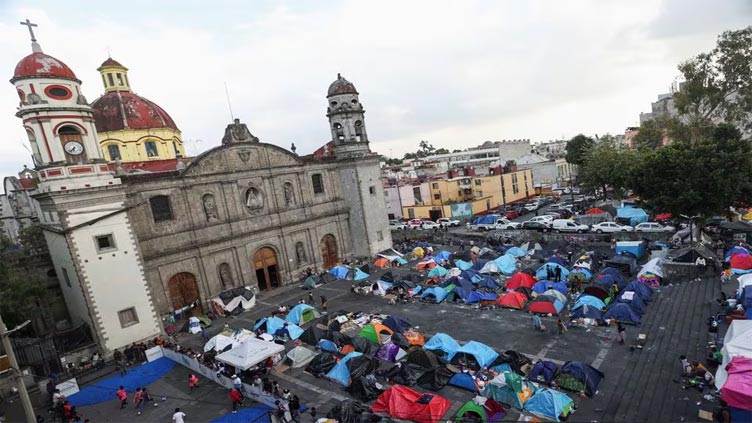 Historic Mexico church becomes capital's largest shelter for weary migrants