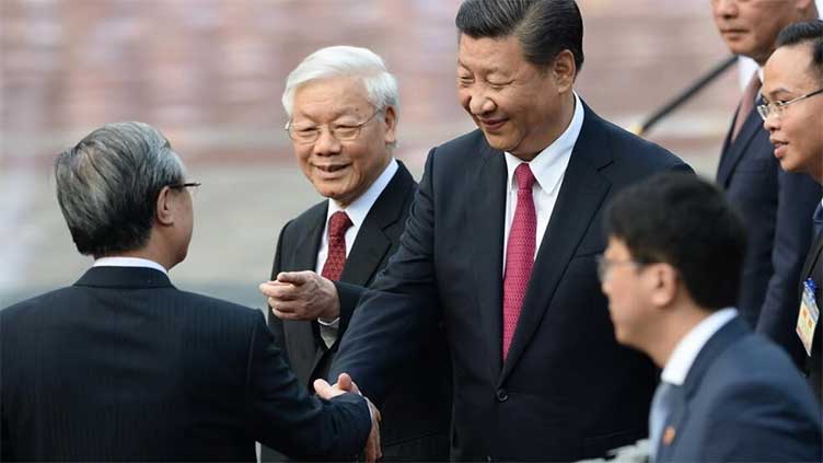 China's Xi looks to strengthen Vietnam ties after Biden visit