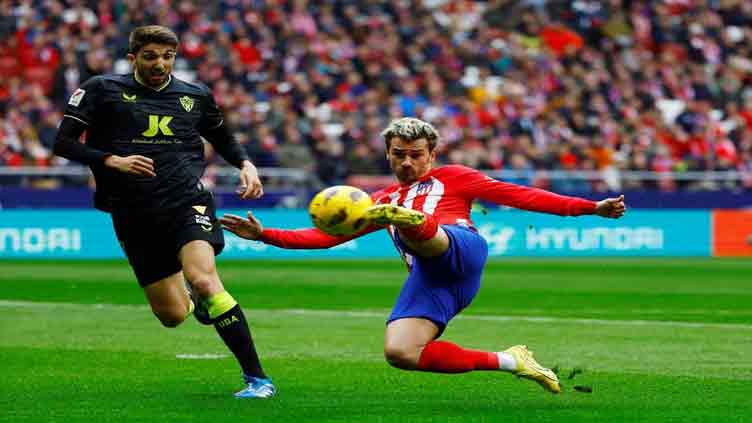 Atletico hold on to edge bottom side Almeria 2-1