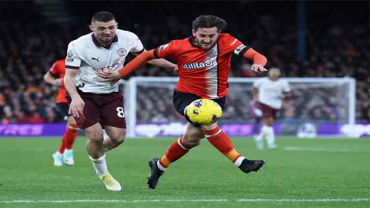 Manchester City return to winning ways with 2-1 victory over Luton