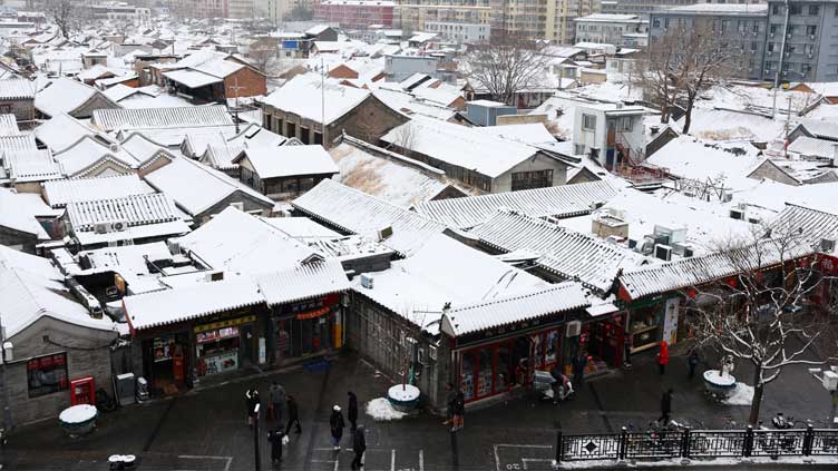 Snowfall shrouds north China in prelude to even colder weather