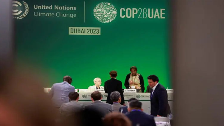 Countries push for COP28 deal on fossil fuels as talks spill into overtime