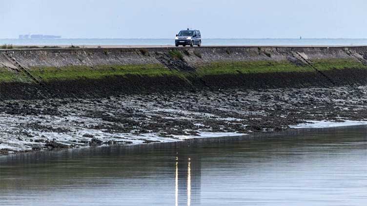 At least one dead as boat carrying more than 60 migrants capsizes in English Channel