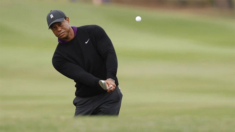 Tiger makes pro-am walk ahead of title hunt with son Charlie