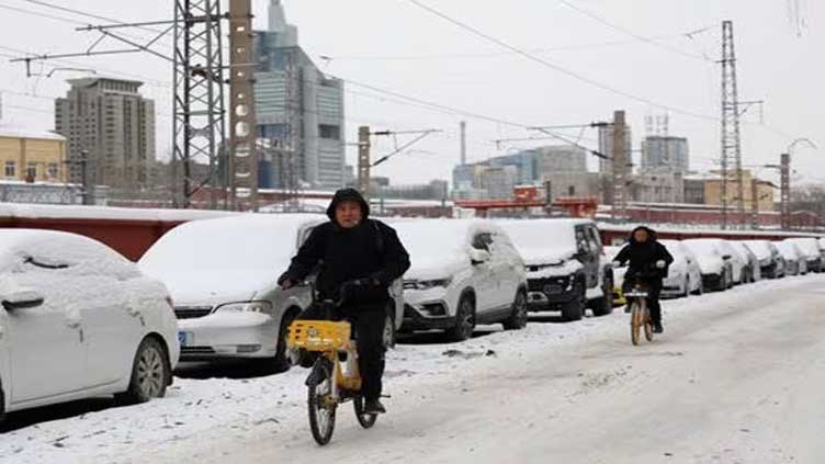 Parts of China gripped by record-low temperatures as icy snap intensifies