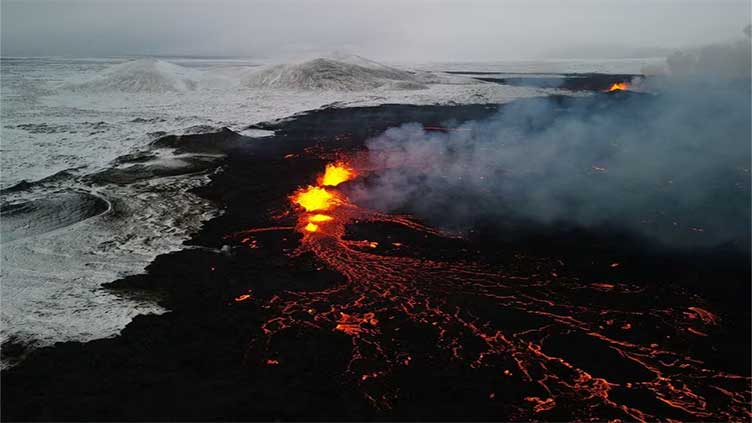 Iceland volcano unlikely to impact flights; lava flows away from town