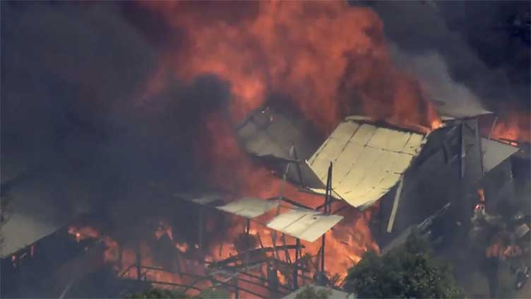 Homes feared destroyed by wildfire burning out of control on Australian city of Perth's fringe