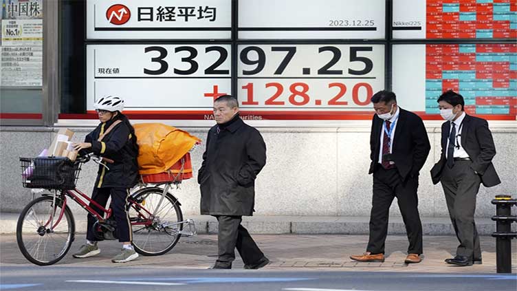 Stock market today: Asian shares gain in quiet holiday trading after Wall St's 8th winning week