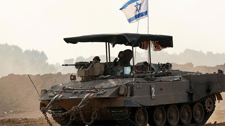 Israeli tanks push deep into central Gaza town; Palestinians flee in mass exodus