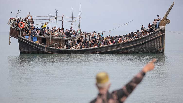 Indonesia navy drives away boat carrying Rohingya - military