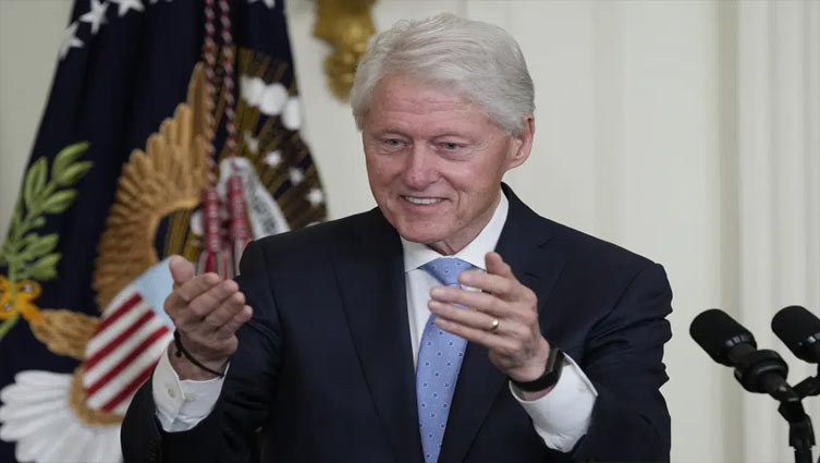 Bill Clinton back at White House to push paid family leave