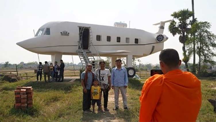 Inspired by dream of flying, Cambodian man builds 'airplane house'