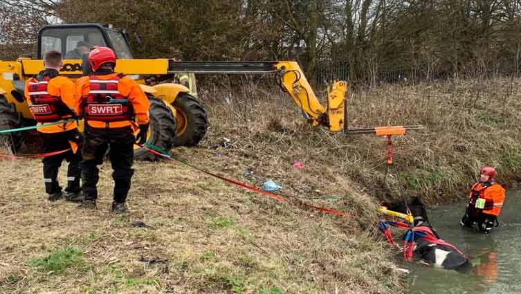 Firefighters hoist horse out of neck-deep water in Britain