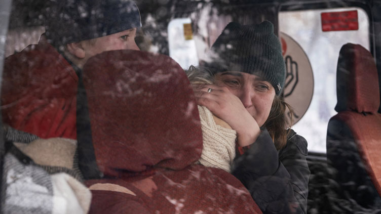 A picture and its story: On the road from Donetsk, evacuation ends in heartbreak