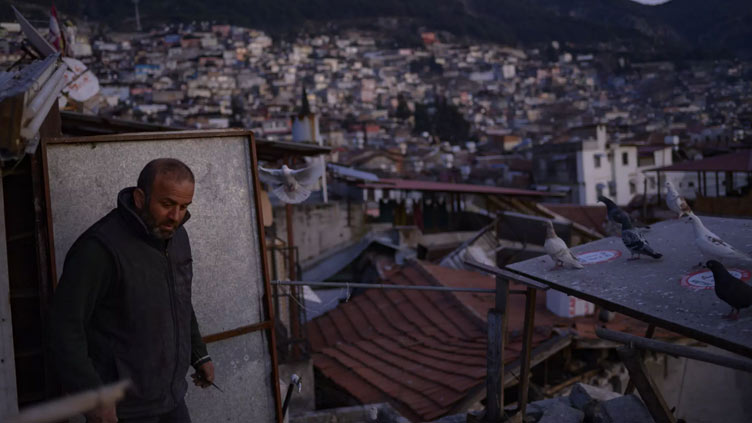 Bird man in Turkiye vows to tend to flock after quake