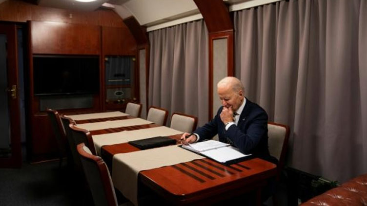 Darkened plane, silent overnight train: how Biden got to Kyiv