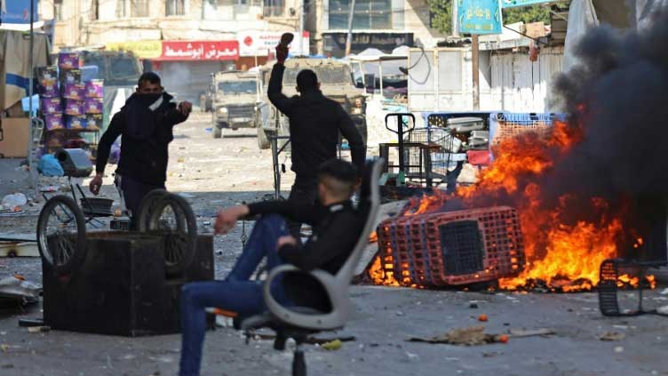  At least ten Palestinians martyred, dozens shot in Israel West Bank raid