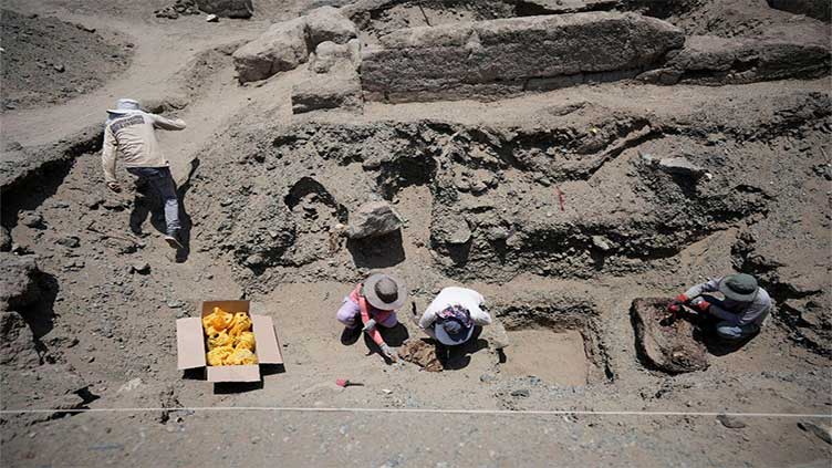 Peruvian archaeologists unearth 30 pre-Inca era graves