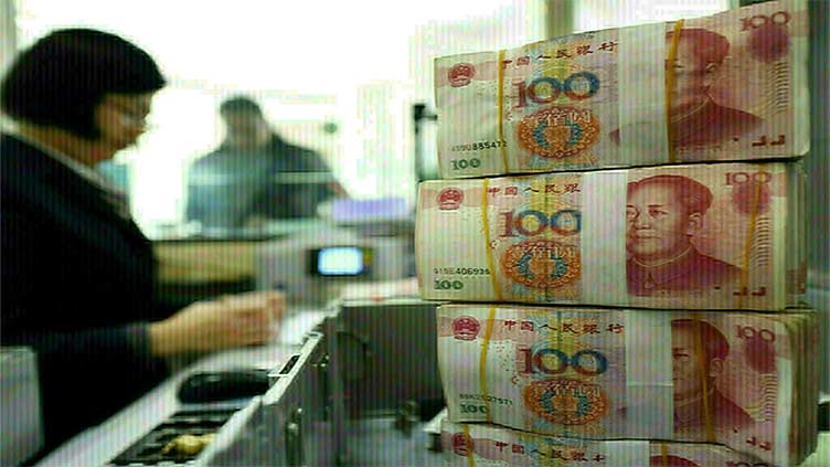 China's yuan slips to two-month low, market focus turns to key seven mark