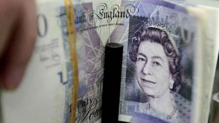 Sterling holds gains after rising on UK trade deal with EU