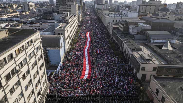 Conservative Peruvian groups march for peace ahead of fresh protests