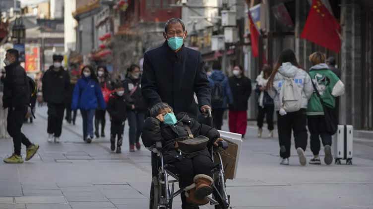 Beijing threatens response to 'unacceptable' virus measures