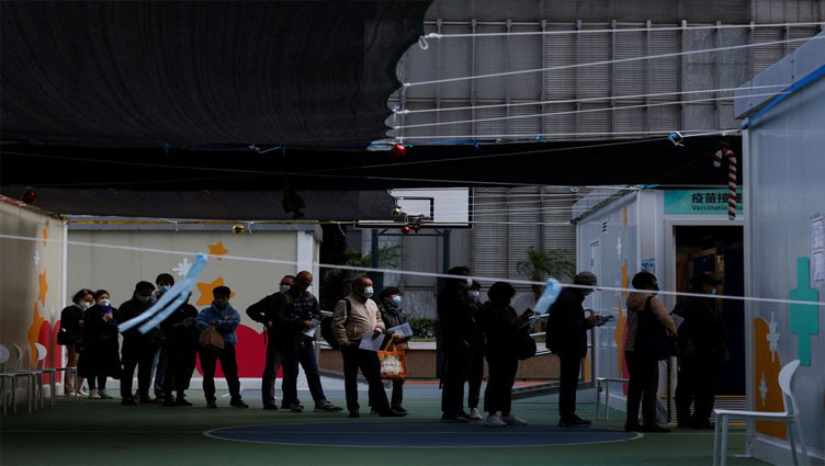 Hong Kong residents rush to get vaccinated ahead of China border reopening