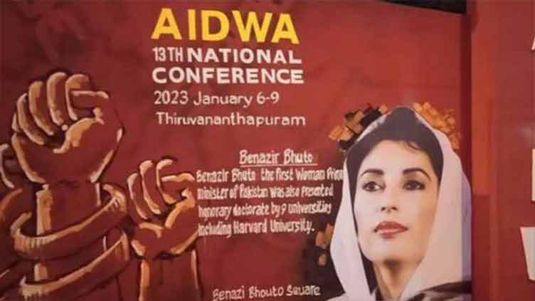 Indian street walls decorated with Benazir's pictures