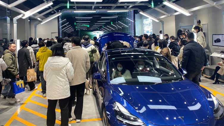  Tesla owners in China protest against surprise price cuts they missed