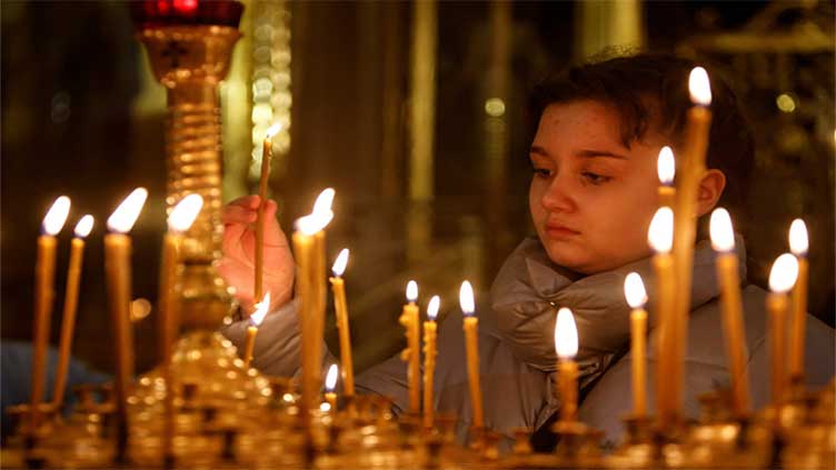 Ukrainians mark Orthodox Christmas in Europe with a prayer to return home