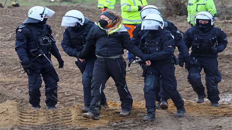 German police drag away activists protesting coal mine expansion