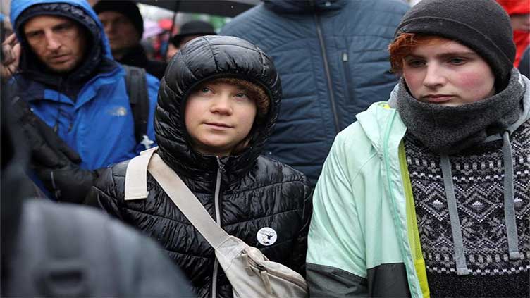 Greta Thunberg joins march on German village in protest against coal mine expansion