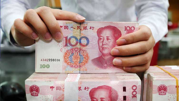 China's yuan slips to one-week low on pre-holiday demand