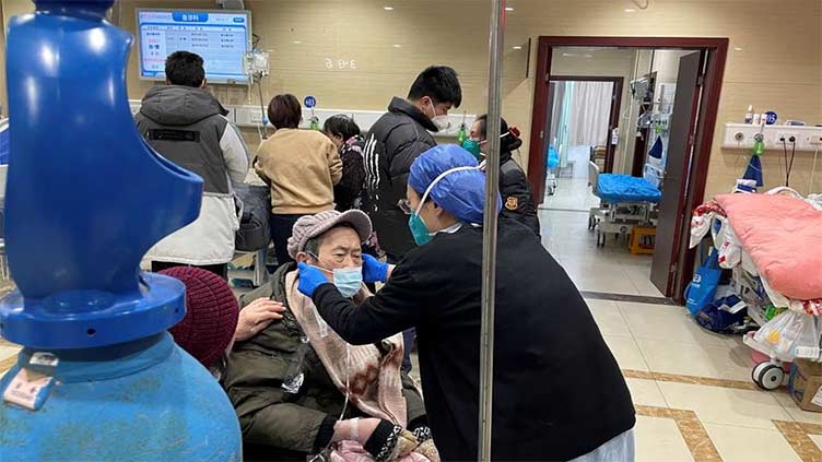 China says Covid outbreak easing on eve of travel rush