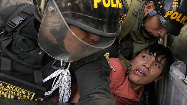 Peru police use tear gas to block protesters from marching