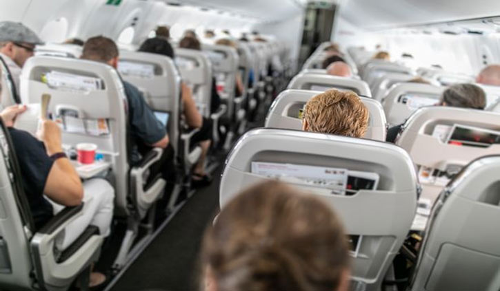 Woman stops cheeky seat-swapping passenger on a flight