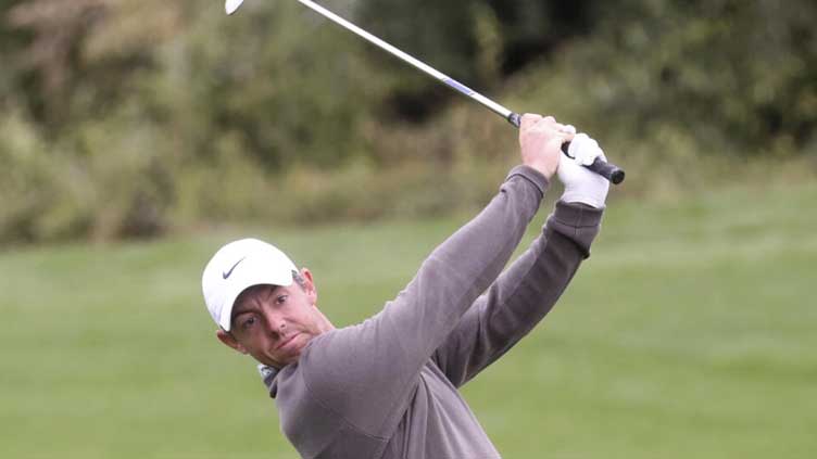 Bland shares Dubai lead as McIlroy heads for driving range