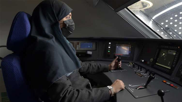  Women drive fast train to Mecca as Saudi workforce evolves