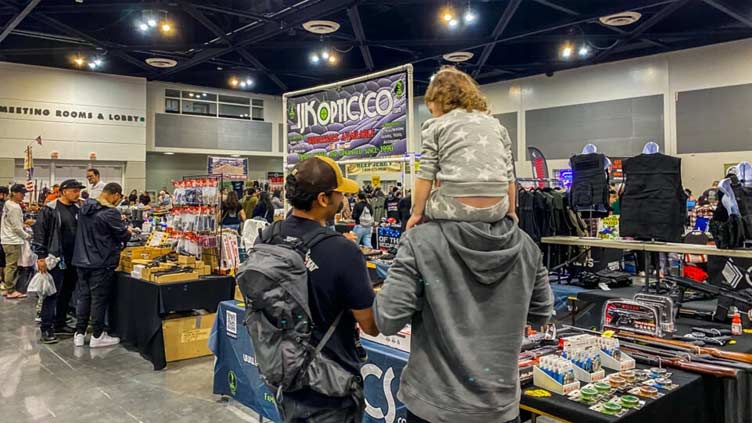 At California gun fair, few speak of recent massacres