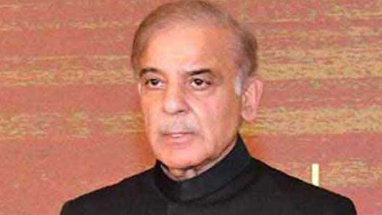 PM Shehbaz pays homage to father by visiting his grave