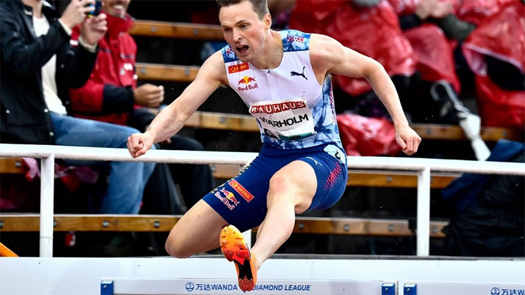 Warholm wins 400m hurdles race hit by environmental protest in Stockholm